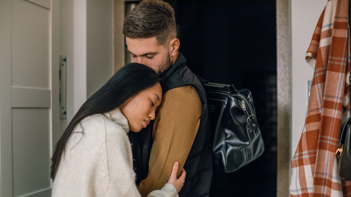 Couple hugging goodbye