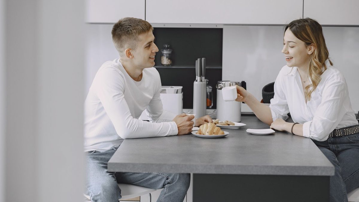 Couple talking kitchen
