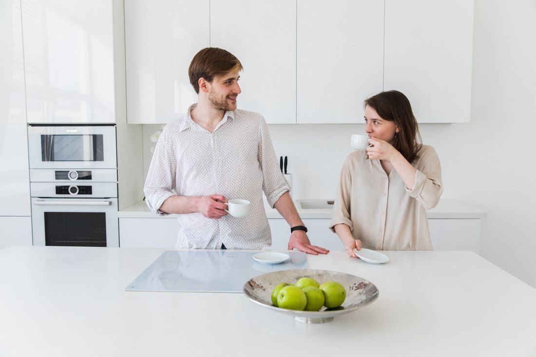 Couple talking kitchen