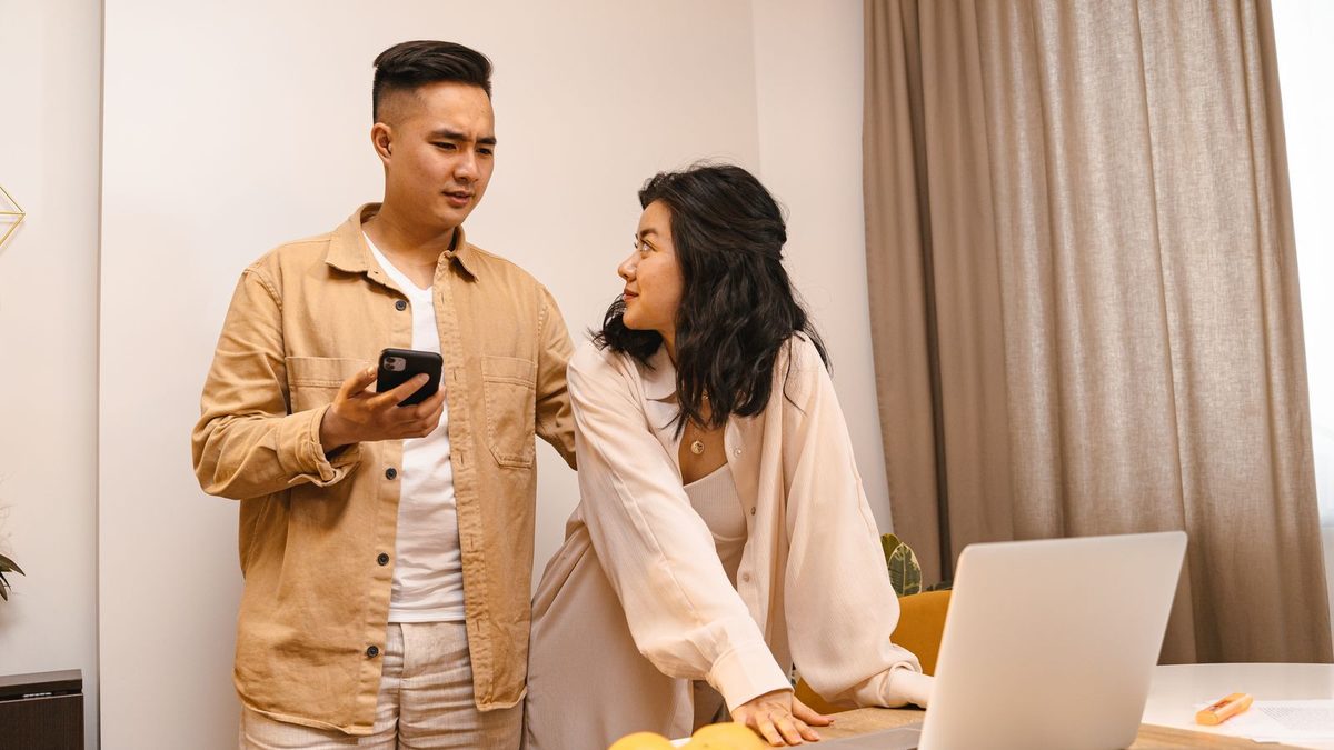 Couple sharing phone