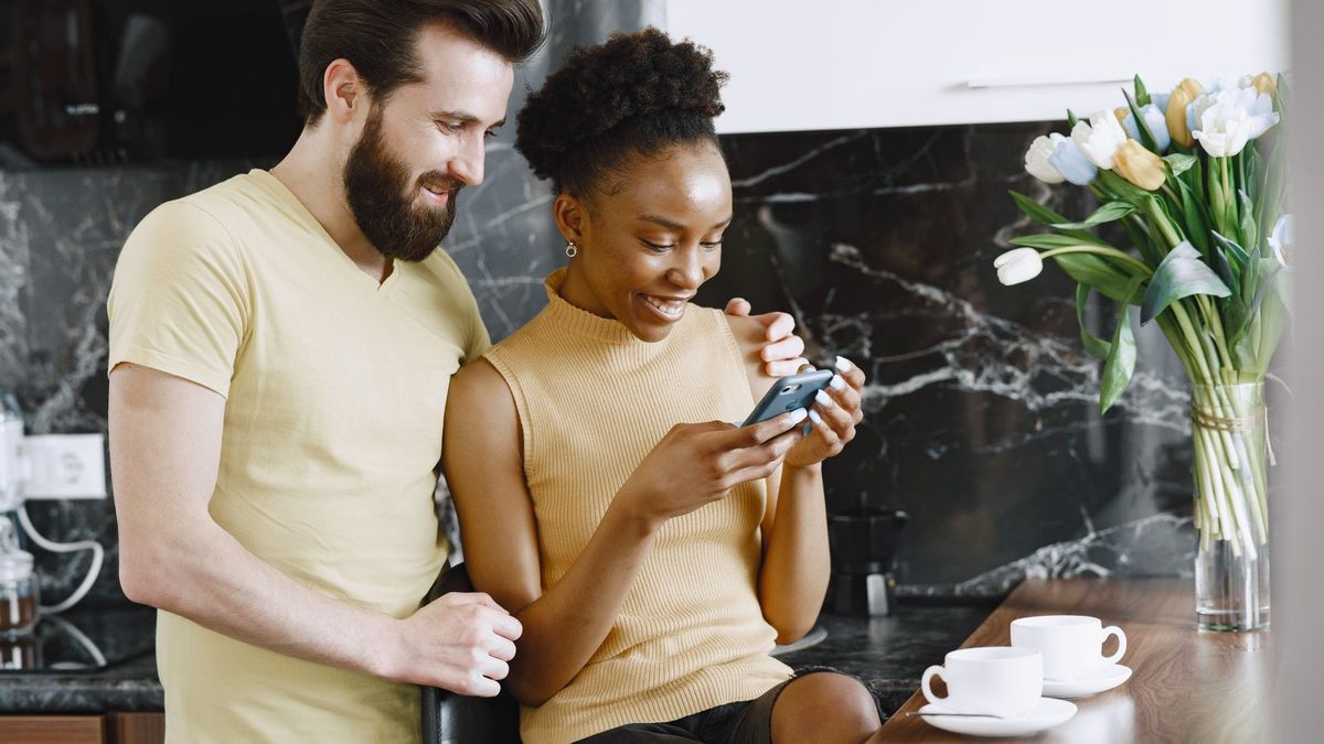 Couple sharing phone
