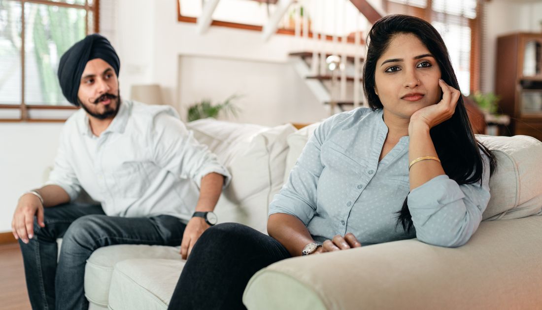 Couple sitting apart