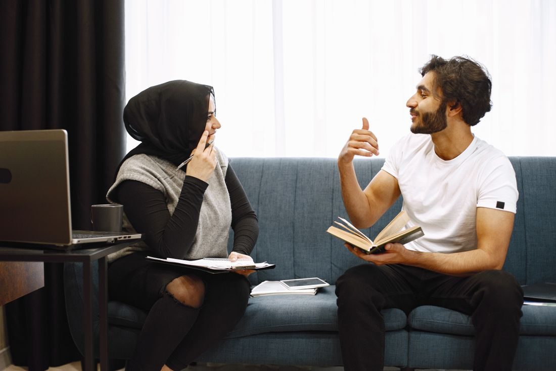 Couple talking sofa