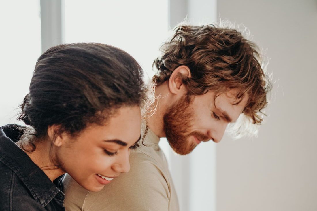 Woman hugging partner