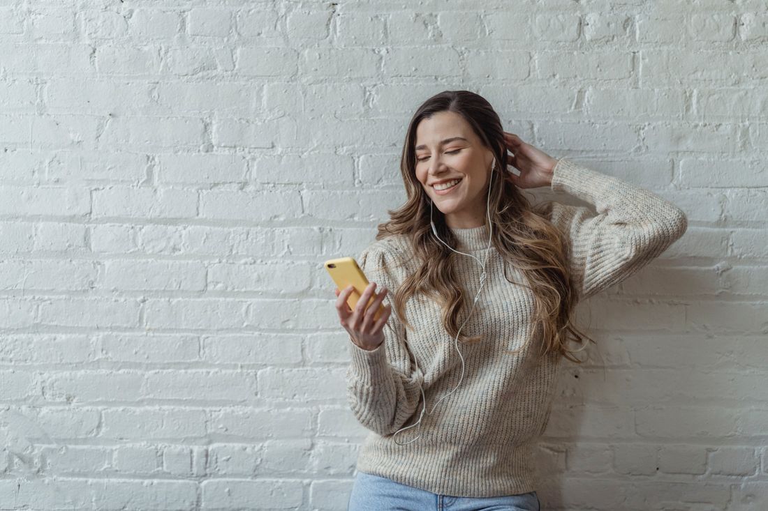 Woman using earphones