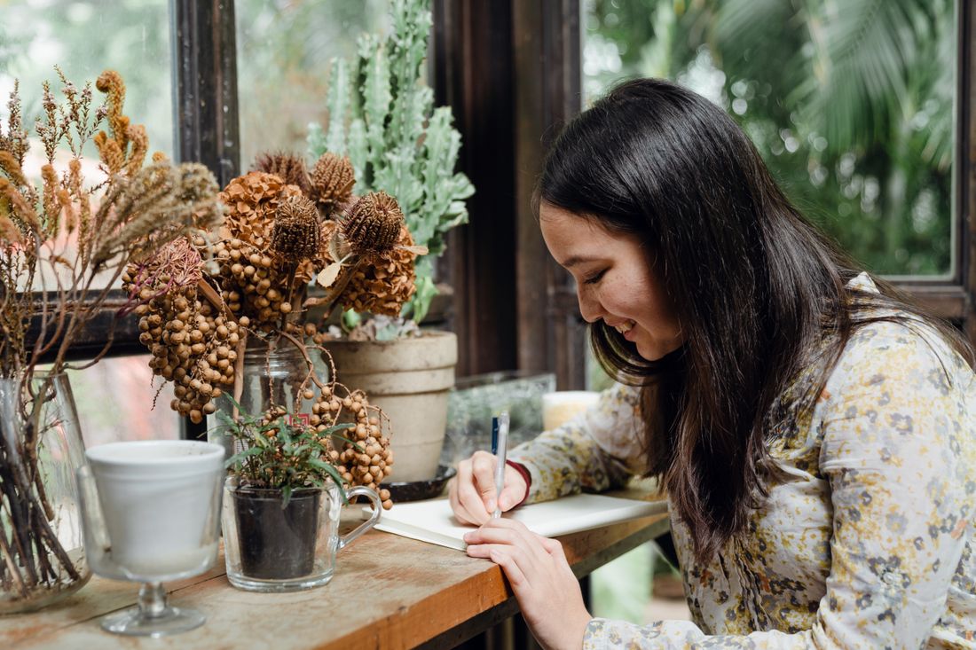 Woman writing journal